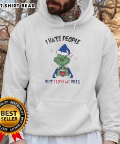 Premium Grinch hoodie featuring 'I Hate People But I Love My Buffalo Bills Merry Christmas' design for festive fans.