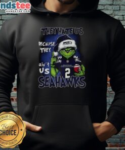 Premium Grinch Santa Hat X Seattle Seahawks NFL hoodie, perfect for Christmas fans who embrace the 'They Hate Us' spirit.