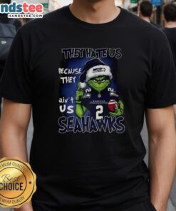 Premium Grinch Santa Hat on Seattle Seahawks NFL Christmas T-Shirt: They Hate Us Because They Ain't Us design.