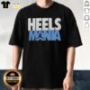 Premium Heels Mania North Carolina Tar Heels logo T-shirt featuring a stylish design for fans of UNC basketball.
