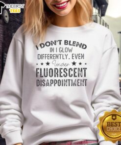 Premium sweatshirt featuring 'I Don't Blend In, I Glow Differently' quote, perfect for standing out in fluorescent light.
