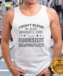 Premium tank top featuring 'I Don't Blend In, I Glow Differently' quote, perfect for standing out in fluorescent light.
