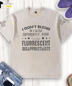 Premium I Don't Blend In I Glow Differently Quote Washed T-Shirt showcasing a unique design under fluorescent lighting.