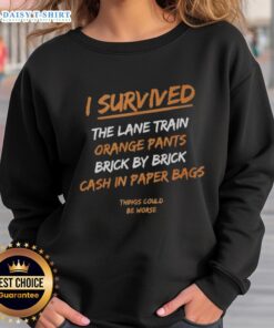 Premium I Survived The Lane Train sweatshirt with orange pants and cash-in paper bags, perfect for casual style.