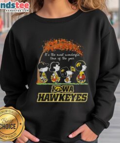 Alt Text: Premium Iowa Hawkeyes X Peanuts Snoopy and Friends autumn sweatshirt celebrating the most wonderful time of the year.