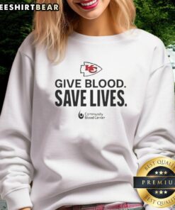 Premium Kansas City Chiefs Give Blood Save Lives sweatshirt featuring team colors and logo, perfect for fans supporting a cause.