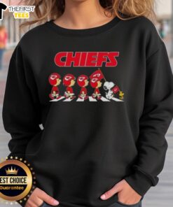 Premium Kansas City Chiefs X Peanuts Snoopy and Friends Abbey Road sweatshirt featuring iconic characters in vibrant design.