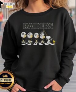 Premium Las Vegas Raiders X Peanuts Snoopy and Friends Abbey Road sweatshirt featuring iconic characters in NFL team colors.