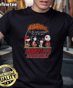 Alt Text: Premium Louisville Cardinals X Peanuts Snoopy and Friends autumn t-shirt featuring festive holiday graphics.
