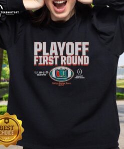 Premium Miami Hurricanes Football 2025 CFP Playoff First Round Winner Sweatshirt, featuring team logo and vibrant colors.
