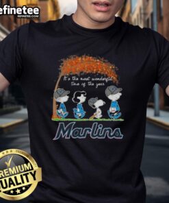 Alt Text: Premium Miami Marlins X Peanuts Snoopy and Friends autumn T-shirt celebrating the holiday season.