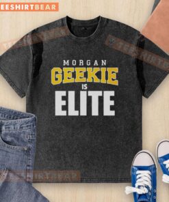 Premium Morgan Geekie Is Elite Boston Bruins Hockey washed t-shirt displayed on a hanger, showcasing team spirit and style.