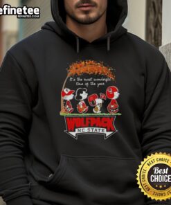 Premium NC State Wolfpack hoodie featuring Snoopy and friends celebrating autumn and the holiday season.