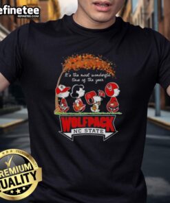 Premium NC State Wolfpack X Peanuts Snoopy and Friends autumn t-shirt featuring festive holiday designs and vibrant colors.