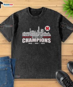 Alt Text: Premium Nebraska Huskers Big Three-Peat Champions 2025 washed t-shirt featuring team logo and vibrant colors.