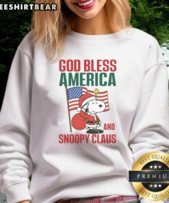 Premium Peanuts God Bless America and Snoopy Claus sweatshirt featuring festive design for holiday celebrations.
