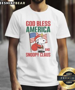 Alt Text: Premium Peanuts God Bless America and Snoopy Claus T-Shirt featuring festive graphics of Snoopy in a patriotic design.