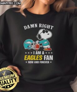 Alt Text: Premium Peanuts Snoopy sweatshirt featuring 'Damn Right I Am an Eagles Fan' design for passionate fans.