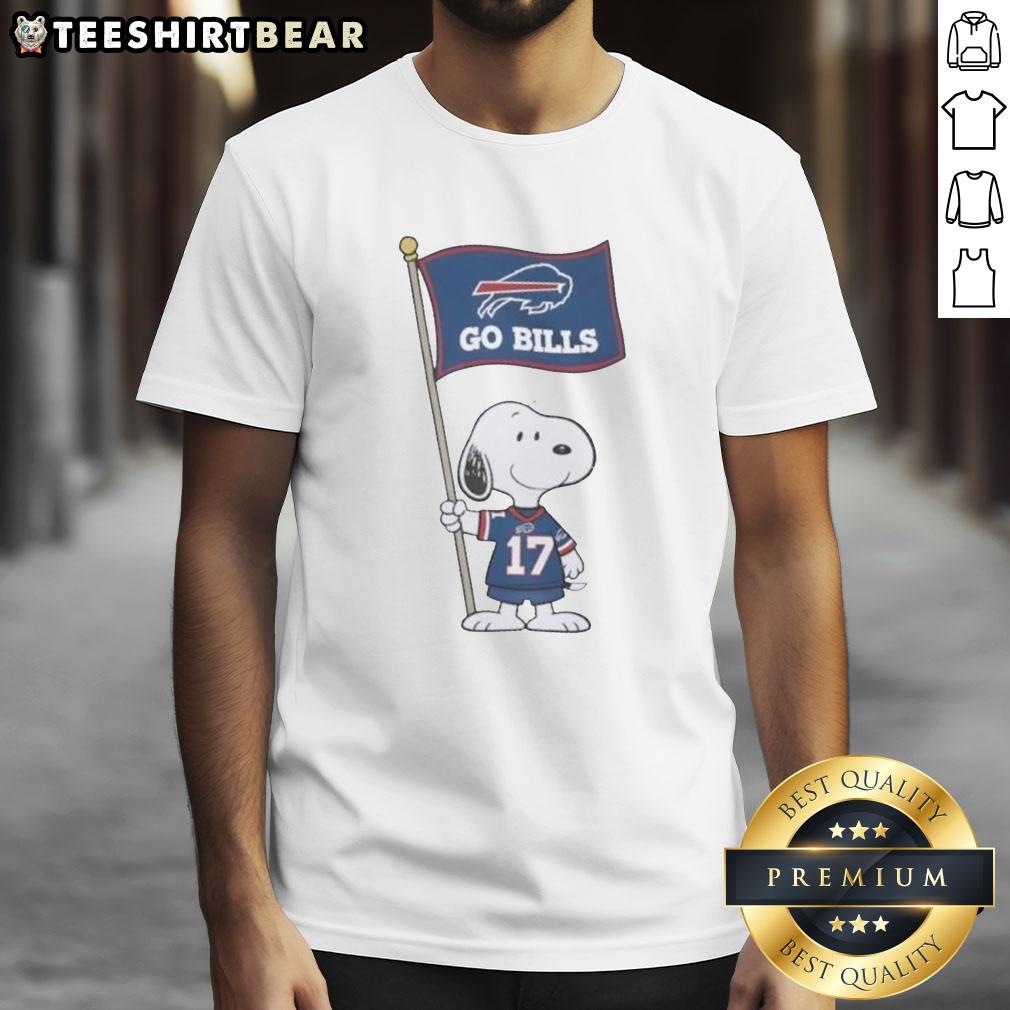 premium-peanuts-snoopy-x-john-allen-buffalo-bills-flag-t-shirt-1 Premium Peanuts Snoopy X John Allen Buffalo Bills Flag T-Shirt featuring Snoopy with a Buffalo Bills flag design.
