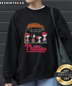 Alt Text: Premium Philadelphia Phillies X Peanuts Snoopy sweatshirt featuring autumn design, perfect for cozy fall days.