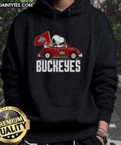 Alt Text: Premium Snoopy and Woodstock driving a car with Ohio State Buckeyes flag hoodie, perfect for fans and cozy wear.