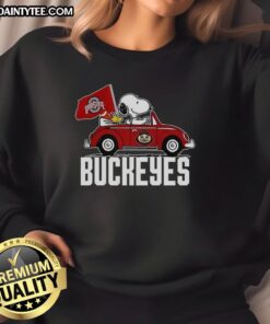 Alt Text: Premium Snoopy and Woodstock driving a car with Ohio State Buckeyes flag on a cozy sweatshirt design.