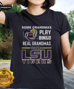 Real grandmas playing bingo in LSU Tigers ladies tee, showcasing fun and spirit for the game in a cozy setting.