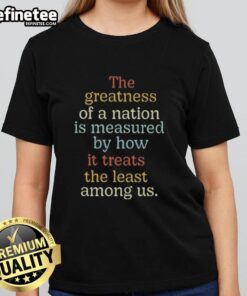 Premium vintage ladies tee featuring 'The greatness of a nation is measured by how it treats the least among us' quote.