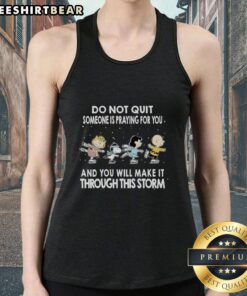 Premium tank top with 'The Peanuts Do Not Quit' print, inspiring message about perseverance and faith during tough times.