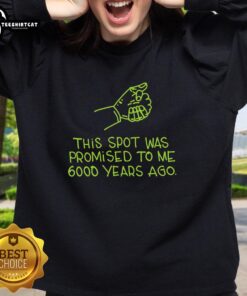 Premium 'This Spot Was Promised to Me 6000 Years Ago' sweatshirt featuring a cozy design and vibrant graphics.