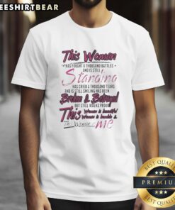 Alt Text: Premium T-shirt featuring 'This Woman Has Fought A Thousand Battles Still Standing' inspirational quote for strong women.