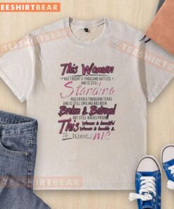 Premium washed t-shirt featuring inspiring quote about resilience and strength: 'This woman has fought a thousand battles.'