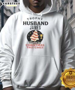 Premium Trophy Husband hoodie featuring James, inspired by Christmas Tree Cakes, perfect for holiday celebrations.