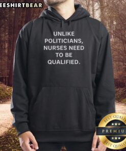 Premium hoodie featuring 'Unlike Politicians, Nurses Need to Be Qualified' slogan, perfect for healthcare supporters.