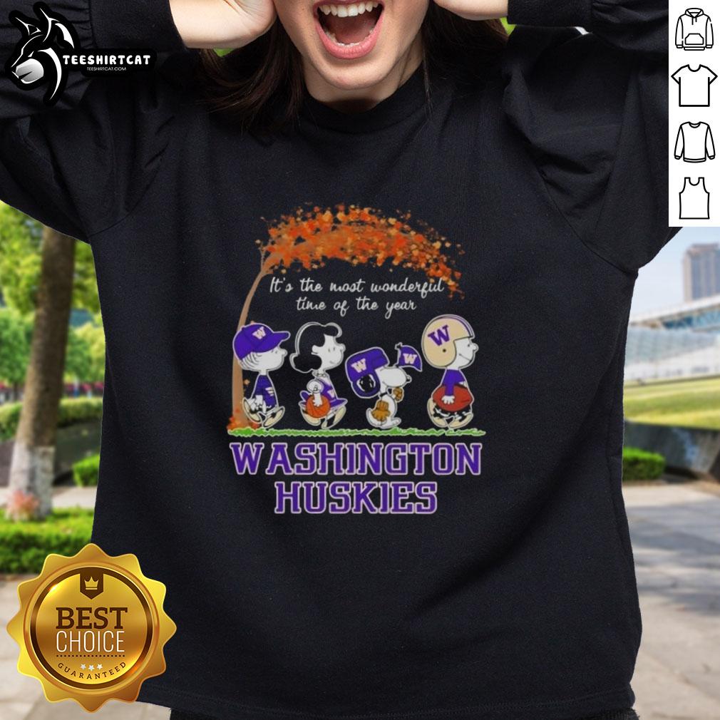 premium-washington-huskies-x-peanuts-snoopy-and-friends-autumn-its-the-most-wonderful-time-of-the-year-sweatshirt Alt Text: Premium Washington Huskies X Peanuts Snoopy sweatshirt celebrating autumn with vibrant colors and cozy design.