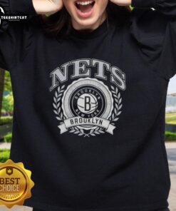 Stylish Brooklyn Nets sweatshirt featuring the National Basketball Association crest, perfect for fans and casual wear.