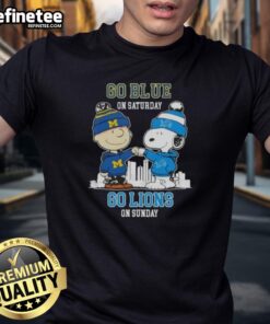 Pretty Charlie Brown fist bump with Snoopy on a blue Detroit Lions skyline t-shirt for game day excitement.