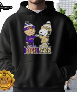 Pretty Charlie Brown fist bump with Snoopy in LSU Tigers x New Orleans Saints hoodie, celebrating Louisiana city sports.