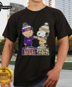 Pretty Charlie Brown fist bump with Snoopy on LSU Tigers x New Orleans Saints t-shirt, showcasing Louisiana city sports pride.