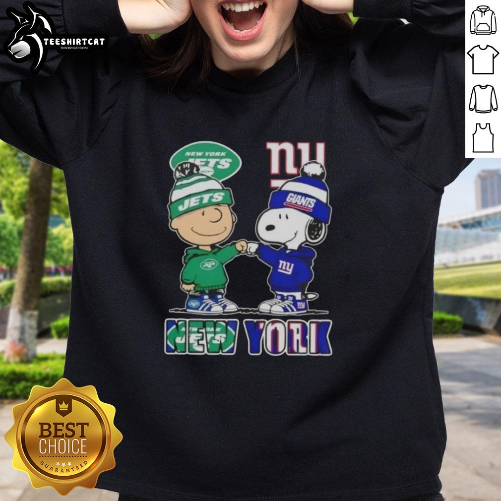pretty-charlie-brown-fist-bump-snoopy-new-york-city-sports-jets-x-giants-sweatshirt Pretty Charlie Brown fist bump with Snoopy, wearing a New York City Jets vs Giants sweatshirt, showcasing sports spirit.