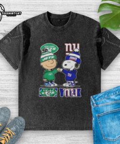 Alt Text: Pretty Charlie Brown fist bump with Snoopy in New York City, wearing Jets x Giants washed t-shirt.