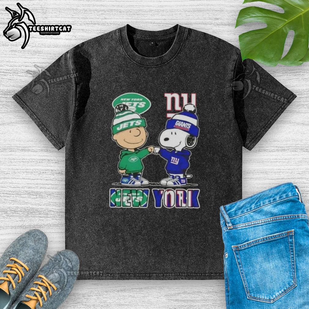 pretty-charlie-brown-fist-bump-snoopy-new-york-city-sports-jets-x-giants-washed-t-shirt Alt Text: Pretty Charlie Brown fist bump with Snoopy in New York City, wearing Jets x Giants washed t-shirt.