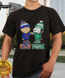 Charlie Brown fist bump with Snoopy on a NYC sports Knicks x Jets t-shirt, perfect for fans and casual wear.