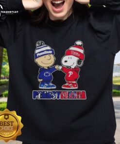 Alt Text: Pretty Charlie Brown fist bump with Snoopy in a Pennsylvania city, featuring Nittany Lions and Philadelphia Phillies sweatshirt.