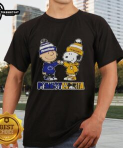Charlie Brown fist bump with Snoopy on a Nittany Lions and Penguins T-shirt, perfect for Pittsburgh fans.