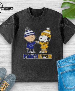 Pretty Charlie Brown fist bump with Snoopy, featuring Nittany Lions and Penguins logos on a washed t-shirt in Pennsylvania.