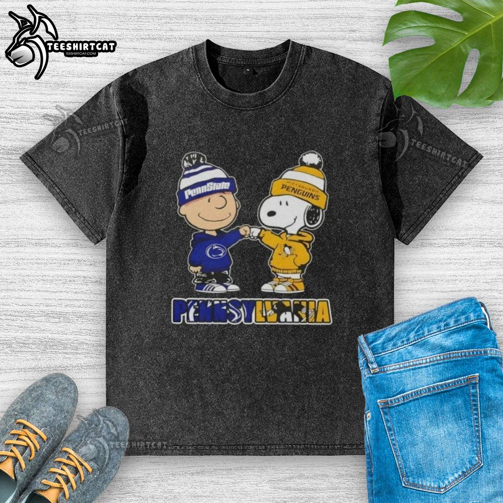 pretty-charlie-brown-fist-bump-snoopy-pennsylvania-city-nittany-lions-x-pittsburgh-penguins-washed-t-shirt Pretty Charlie Brown fist bump with Snoopy, featuring Nittany Lions and Penguins logos on a washed t-shirt in Pennsylvania.