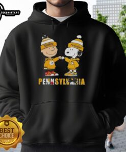 Alt Text: Pretty Charlie Brown fist bump with Snoopy in a Pittsburgh Steelers and Penguins hoodie, celebrating city sports.