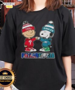 Pretty Charlie Brown fist bump with Snoopy, featuring Philadelphia sports theme on a ladies tee celebrating Phillies and Eagles.
