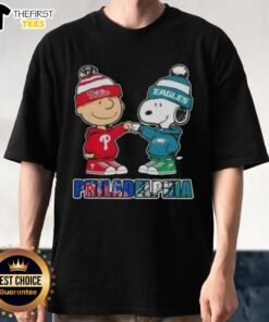 Pretty Charlie Brown fist bumping Snoopy on a Philadelphia City Sports Phillies X Eagles T-Shirt design.